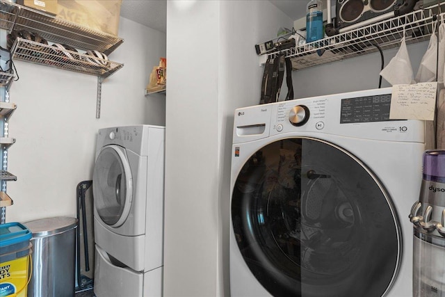 laundry room with laundry area and washer / clothes dryer