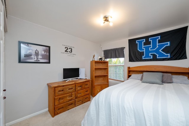 carpeted bedroom with baseboards