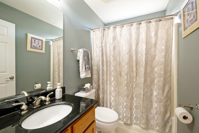 bathroom with toilet and vanity