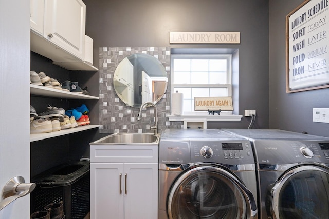 laundry room featuring a sink, cabinet space, and washing machine and clothes dryer