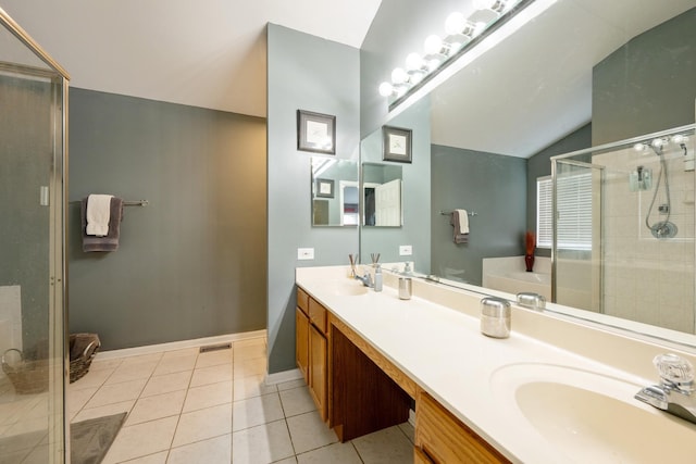 full bathroom featuring a sink, a shower stall, tile patterned flooring, double vanity, and vaulted ceiling