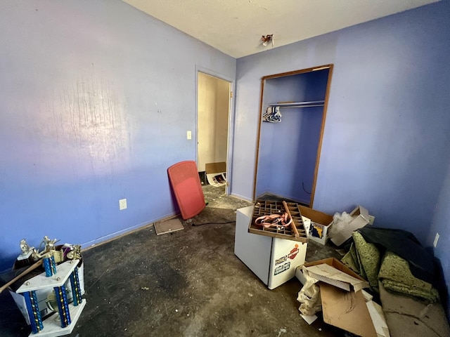 916 Sunset Rdg, Danville, IL 61832 - bedroom featuring a closet and unfinished concrete flooring