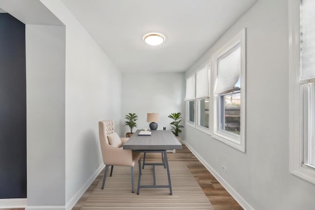 office area featuring baseboards and dark wood-style flooring