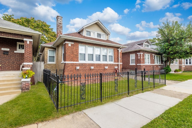 bungalow-style house with a front yard, brick siding, a fenced front yard, and a chimney