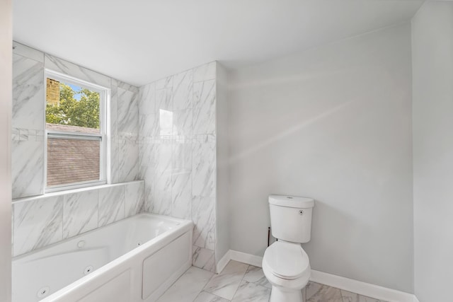 full bath with baseboards, toilet, marble finish floor, and a whirlpool tub