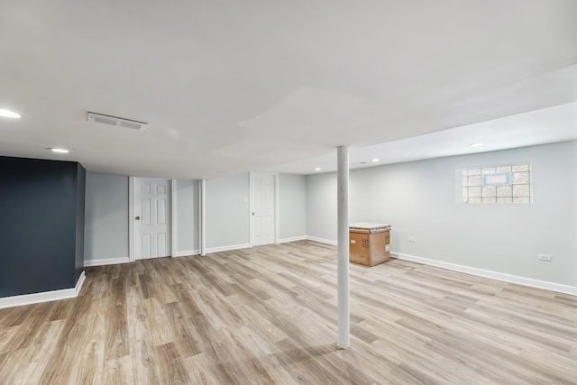 basement featuring visible vents, recessed lighting, light wood-type flooring, and baseboards