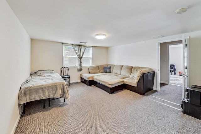 bedroom featuring baseboards, carpet floors, and visible vents