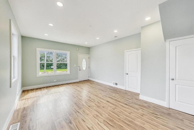 spare room featuring recessed lighting, visible vents, and light wood-type flooring