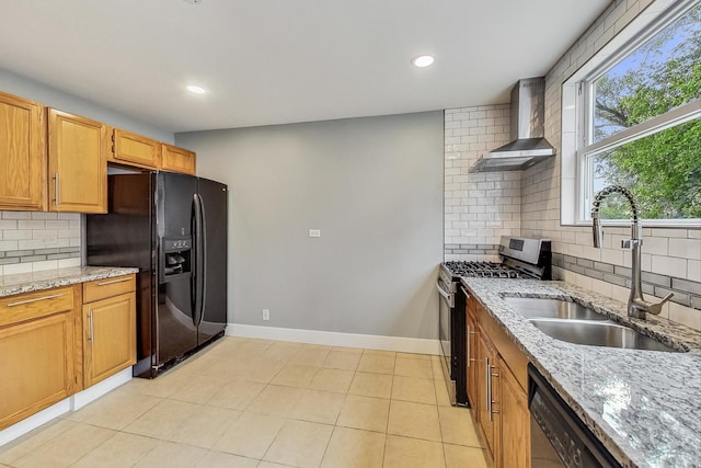 kitchen featuring wall chimney range hood, dishwashing machine, black fridge with ice dispenser, gas stove, and a sink