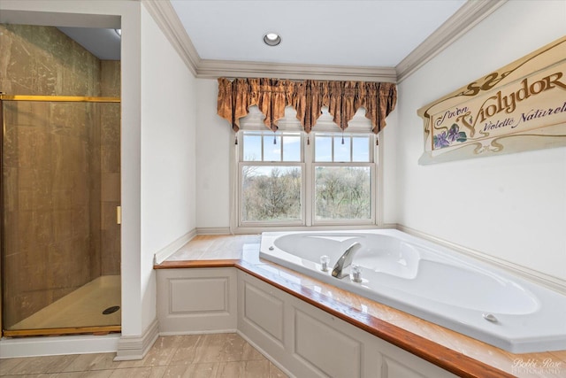full bathroom featuring ornamental molding, a bath, a shower stall, and tile patterned flooring