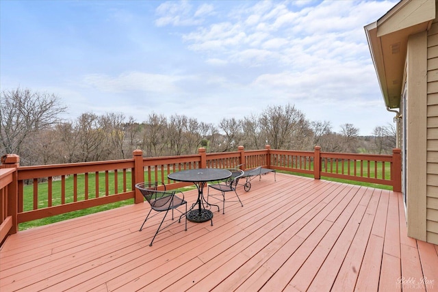 wooden deck with a yard