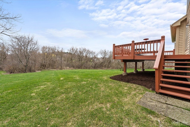 view of yard featuring a wooden deck and stairs