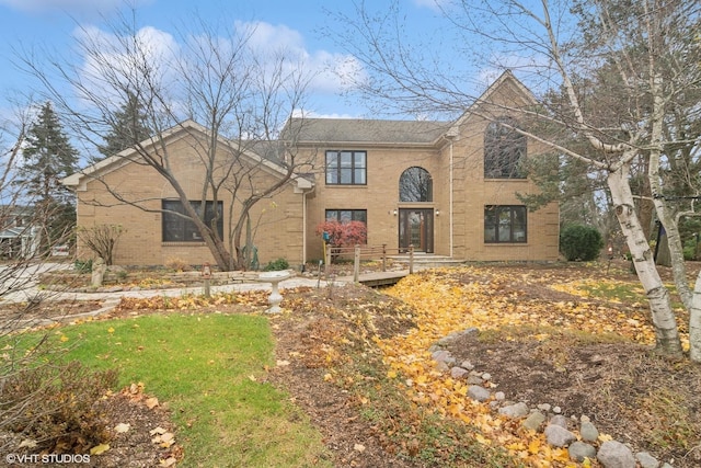 view of front of house with brick siding