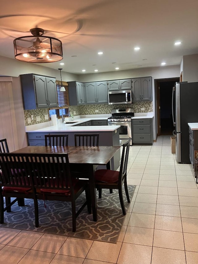 dining area with light tile patterned floors and recessed lighting