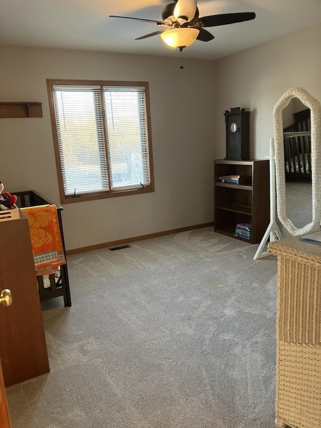 bedroom with visible vents, ceiling fan, baseboards, and carpet