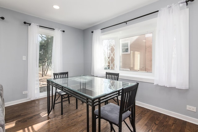 dining room with recessed lighting, dark wood-type flooring, and baseboards