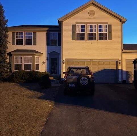 view of front of house with a garage and driveway