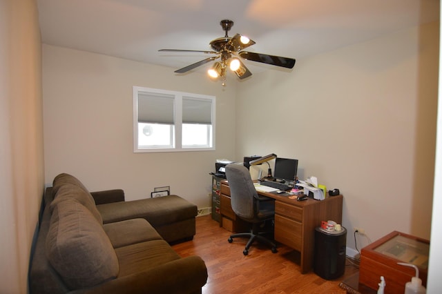 office area featuring light wood-style flooring and ceiling fan