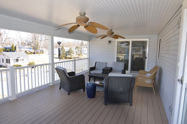 wooden terrace featuring outdoor lounge area and ceiling fan