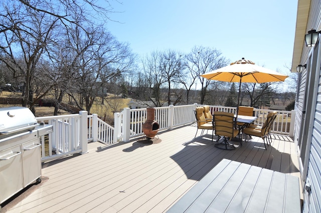 wooden deck with outdoor dining space