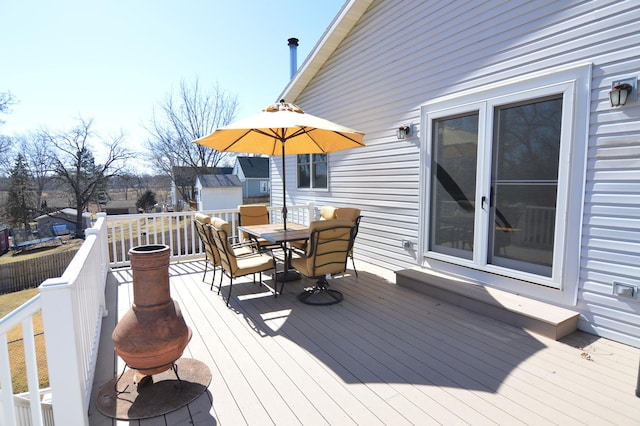 deck featuring outdoor dining area