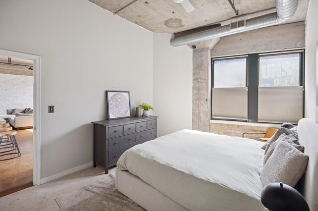 carpeted bedroom with baseboards and visible vents