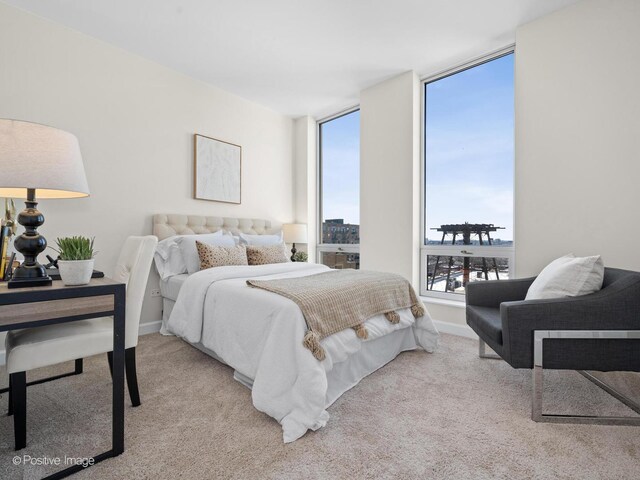 carpeted bedroom with baseboards