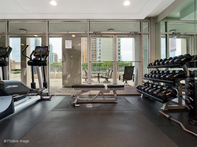 workout area with recessed lighting and expansive windows