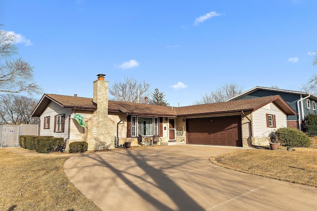 ranch-style house with concrete driveway, an attached garage, fence, and a chimney