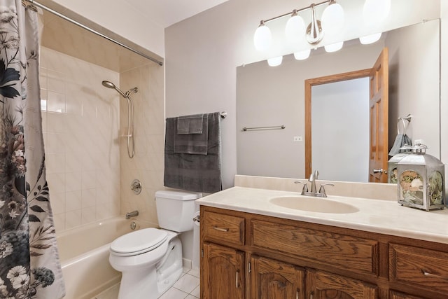 full bathroom featuring tile patterned floors, toilet, vanity, and shower / bath combo