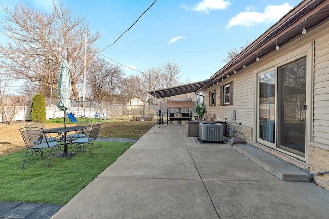 view of patio / terrace featuring central air condition unit and fence