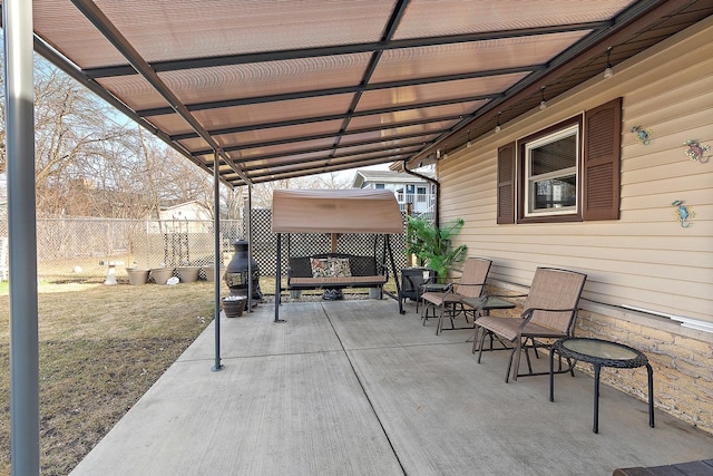 view of patio / terrace featuring fence