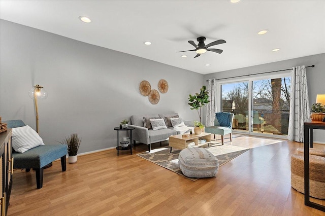 living room featuring recessed lighting, light wood-type flooring, baseboards, and a ceiling fan