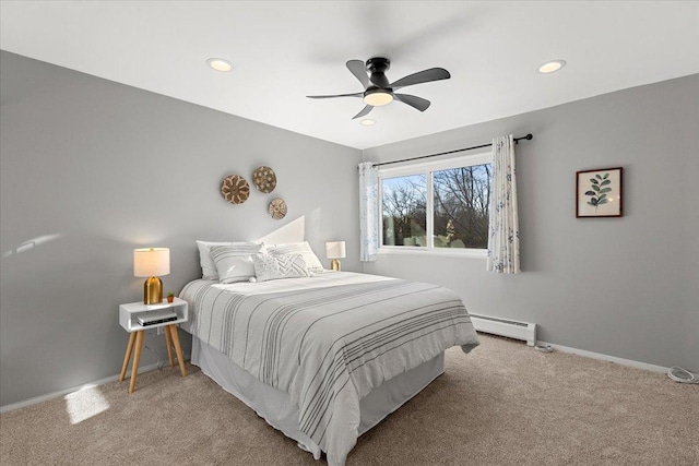 bedroom featuring recessed lighting, light colored carpet, baseboards, and a baseboard radiator