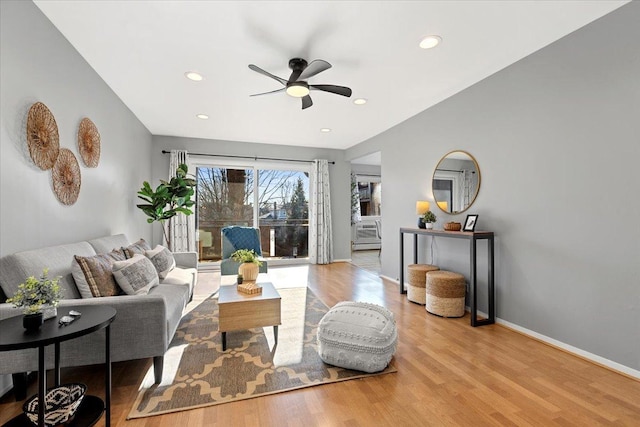 living area with recessed lighting, baseboards, wood finished floors, and ceiling fan