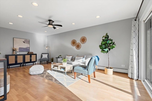 living area featuring ceiling fan, wood finished floors, and recessed lighting