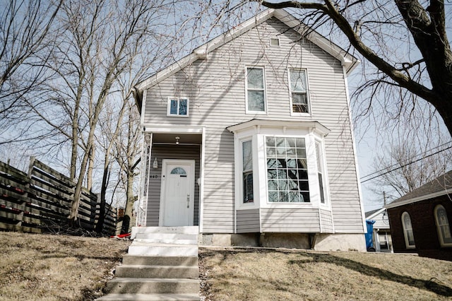 view of front of house with fence