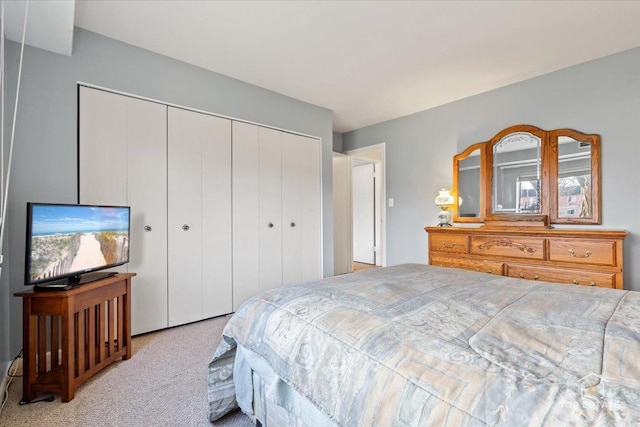 carpeted bedroom featuring a closet