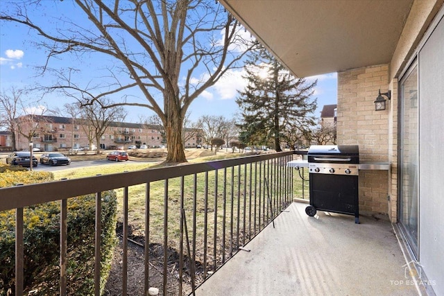 balcony featuring a residential view and grilling area