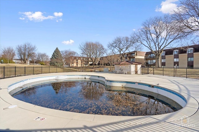 pool featuring a patio area and fence