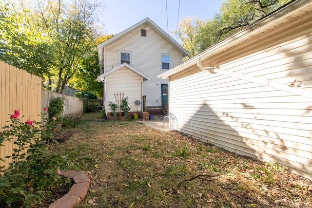 rear view of property with fence