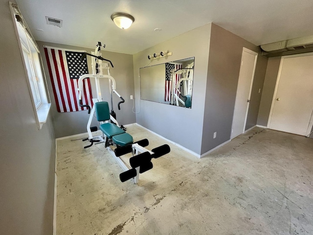 exercise area featuring visible vents and baseboards