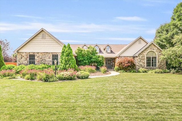 view of front of property with a front yard and stone siding