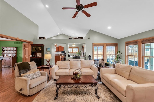 living room with visible vents, high vaulted ceiling, a ceiling fan, wood finished floors, and recessed lighting