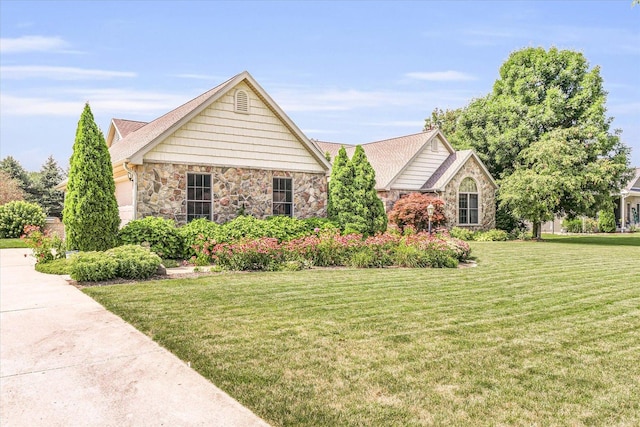 ranch-style home with stone siding and a front lawn