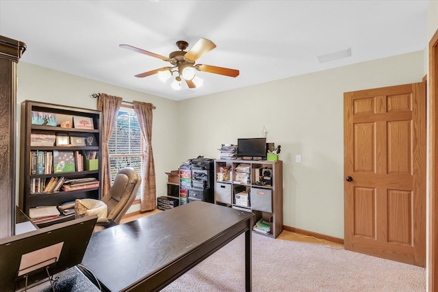 home office with carpet, baseboards, and ceiling fan