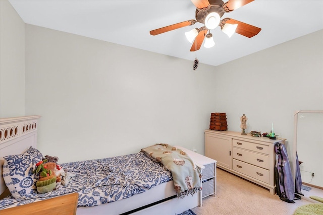 bedroom with light colored carpet and ceiling fan