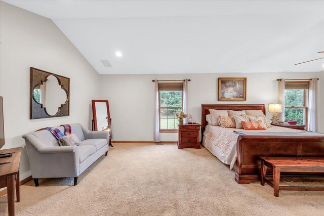 carpeted bedroom featuring multiple windows, baseboards, and lofted ceiling