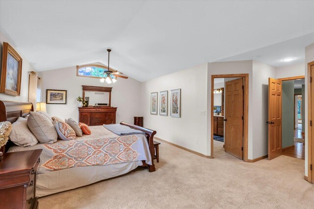 bedroom with light carpet, ceiling fan, baseboards, and lofted ceiling