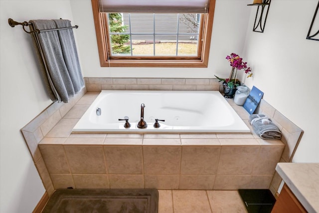 full bath with vanity and a tub with jets